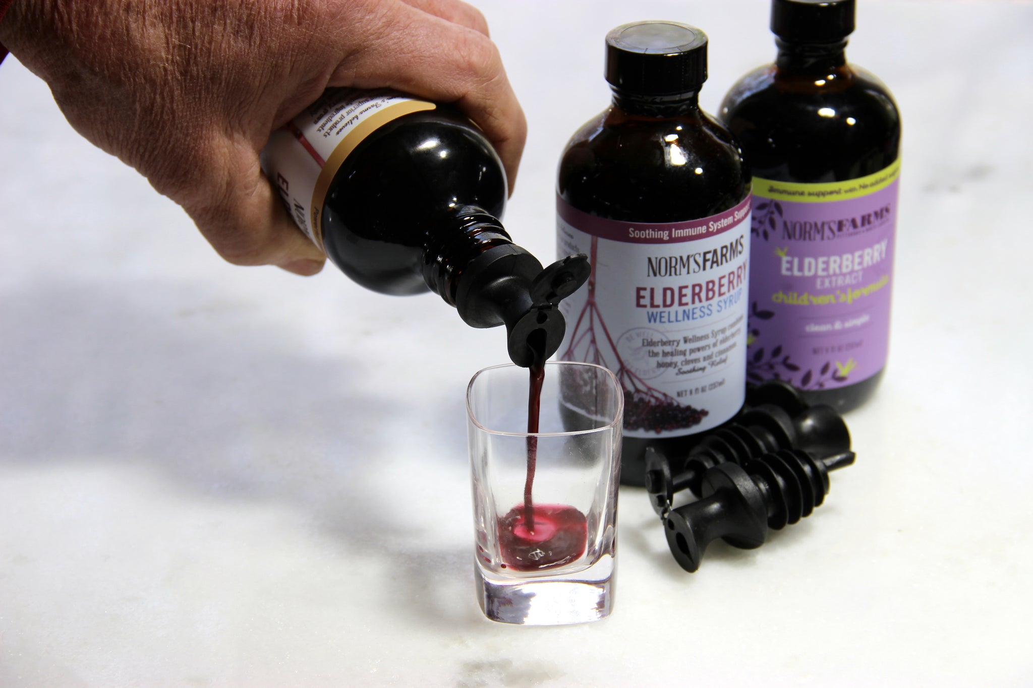 No mess, easy pour, reusable elderberry syrup spout.